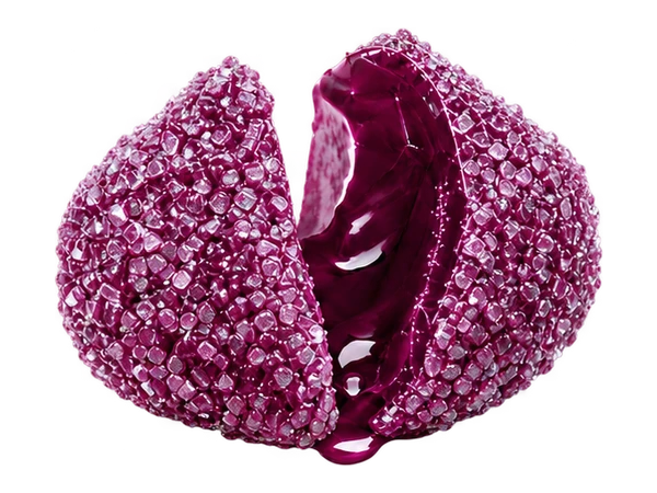 Grape candy split open to reveal its juicy center