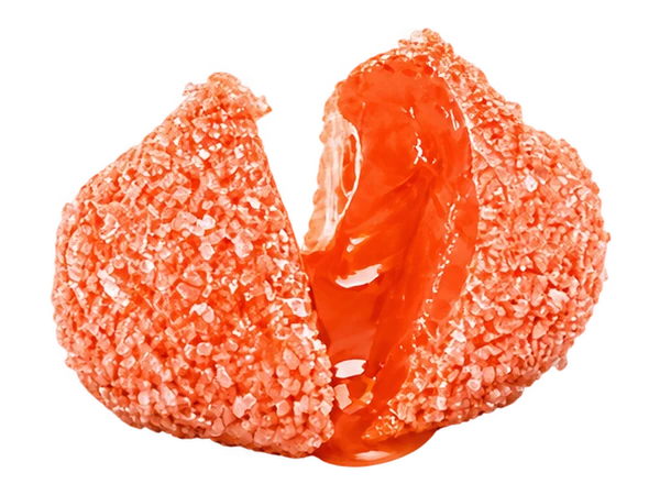 Peach candy split open to reveal its juicy center